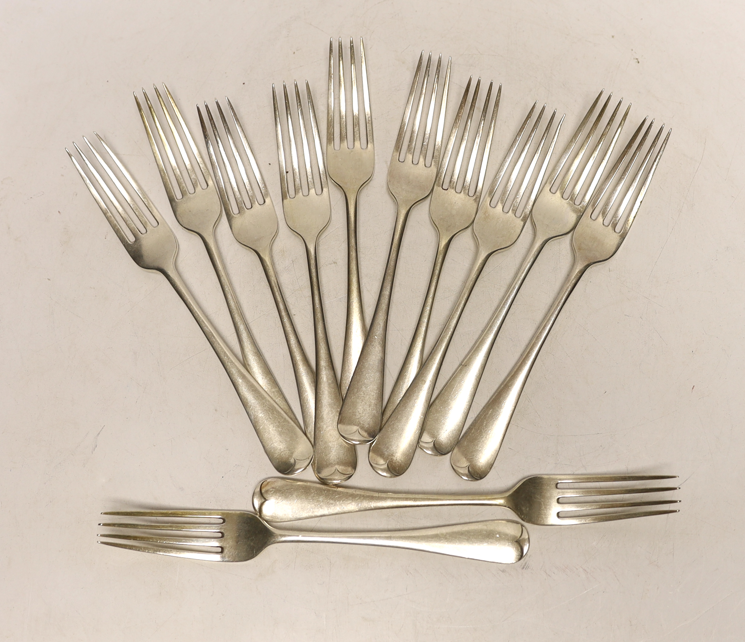 A set of twelve George V silver Old English pattern dessert forks, Goldsmiths & Silversmiths Co Ltd, London, 1930, 20oz.